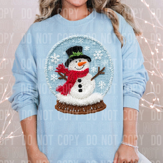 Faux yarn snowman snow globe